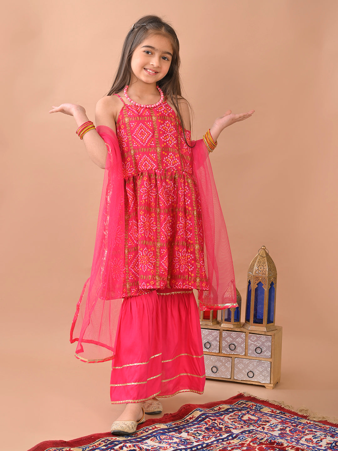 Pink bandez sleeveless Kurti paired with pink sharara pant and dupatta