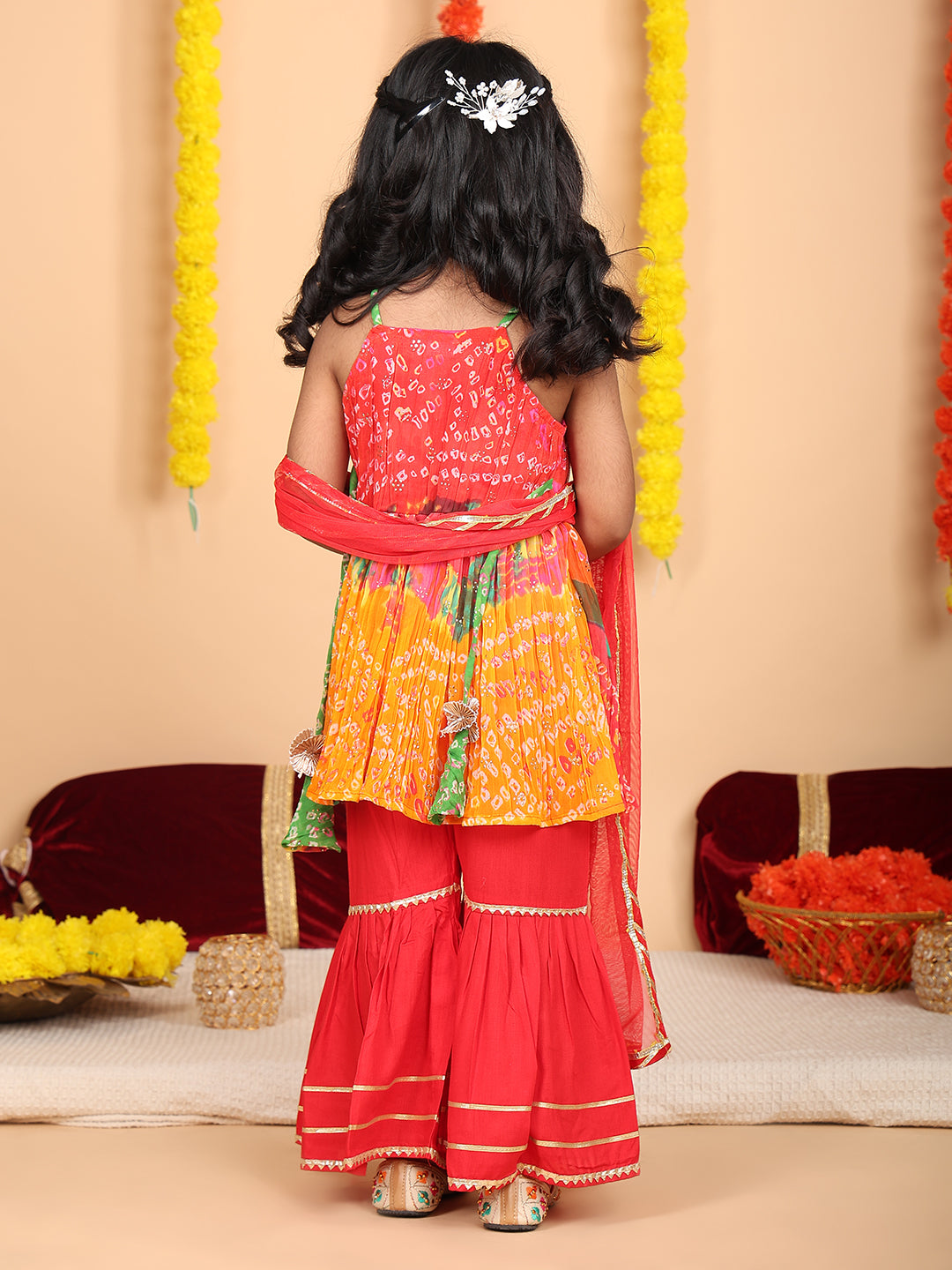 Red bandez printed Crushed sleeveless kurti with red sharara and dupatta