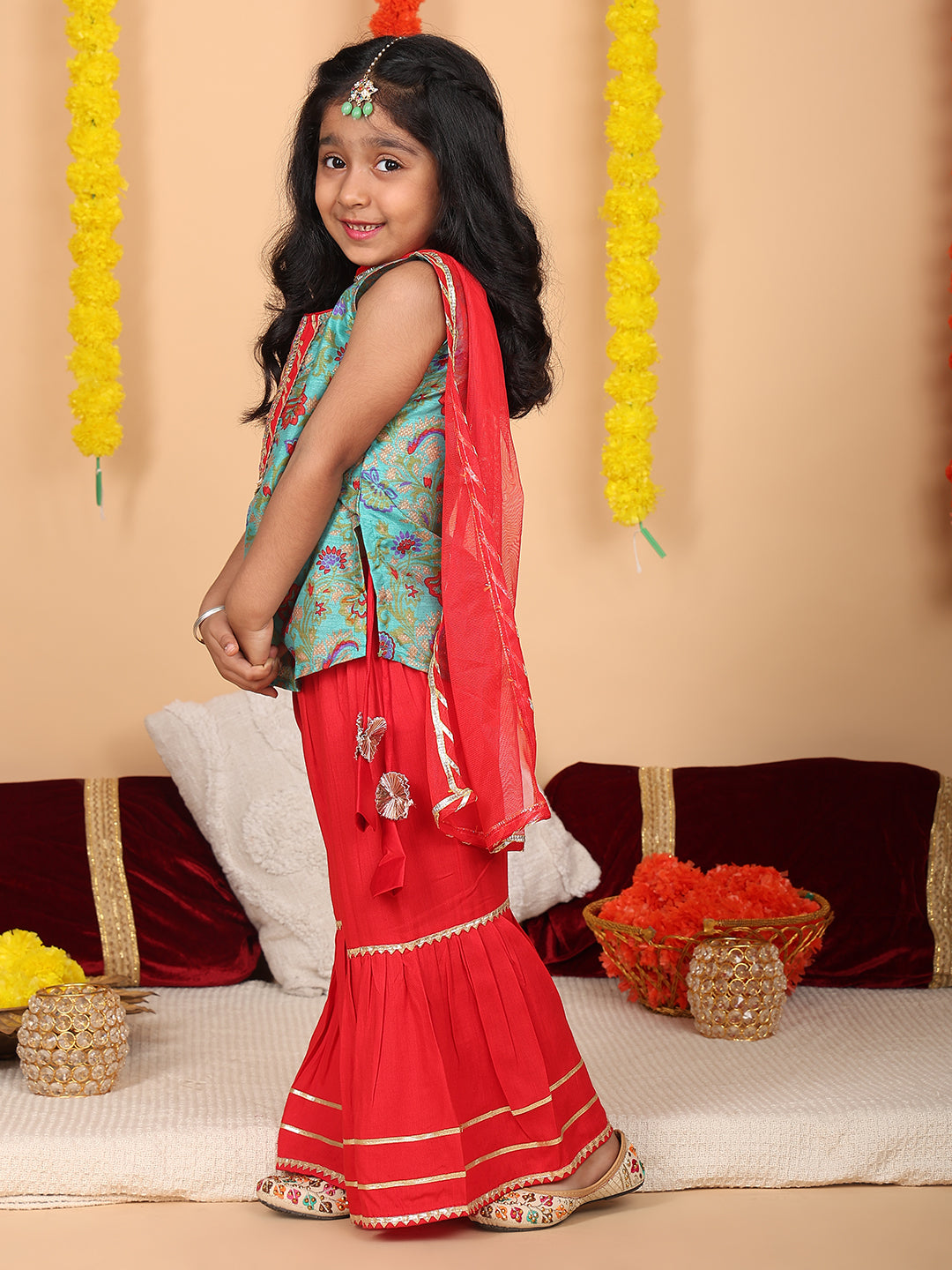 Green printed sleeveless kurti with Red sharara and dupatta