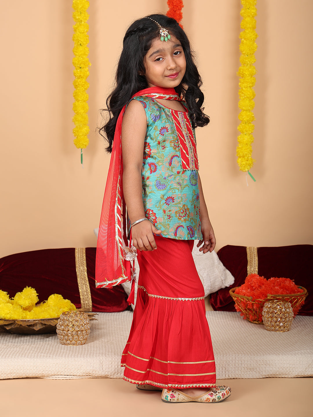 Green printed sleeveless kurti with Red sharara and dupatta