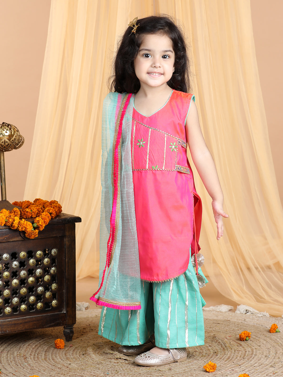 Pink embroidered Kurti paried with gold printed Sharara pant