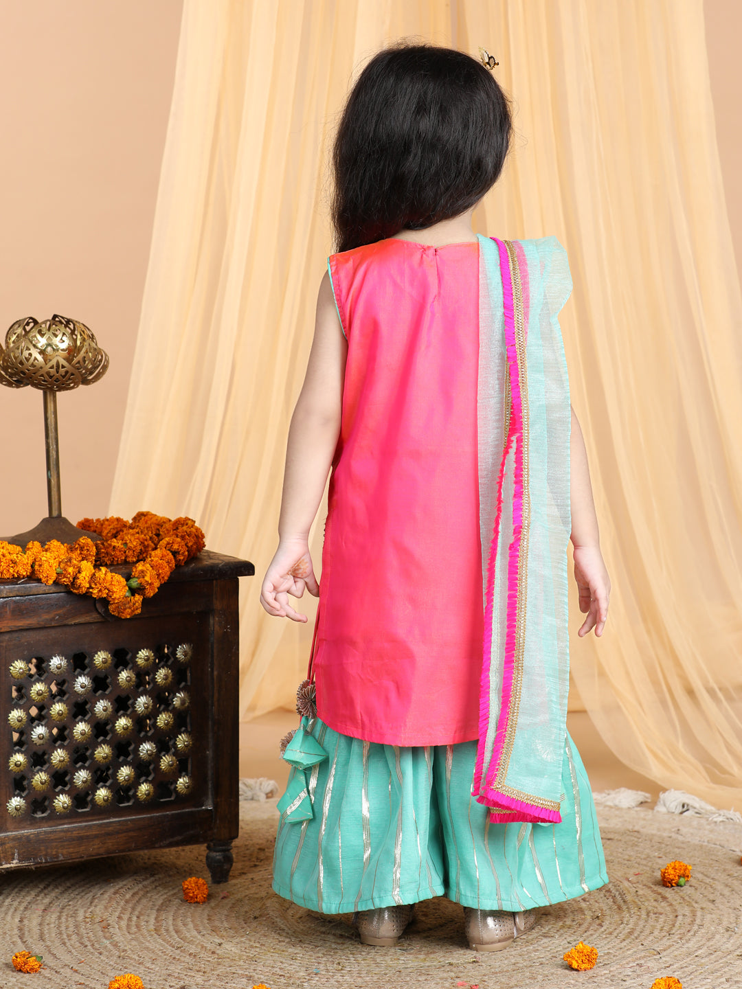 Pink embroidered Kurti paried with gold printed Sharara pant