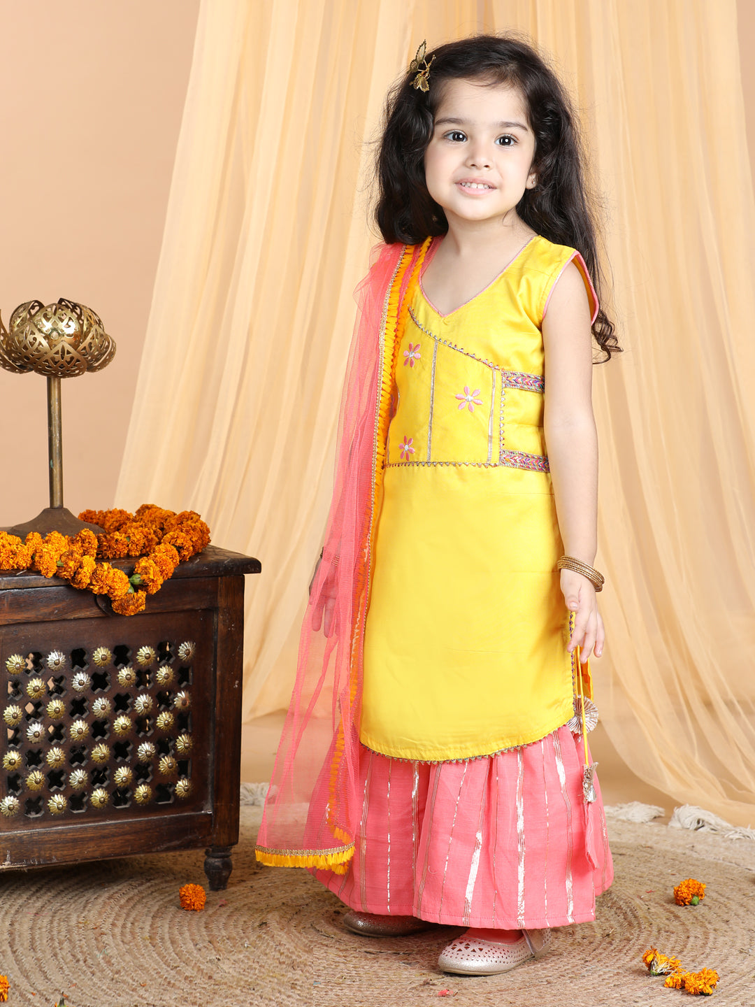 Yellow embroidered Kurti paried with gold printed Sharara pant