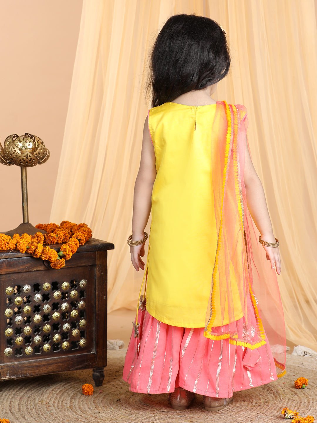 Yellow embroidered Kurti paried with gold printed Sharara pant