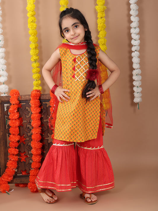 Yellow sleeveless cotton kurti with Red sharara pant and dupatta