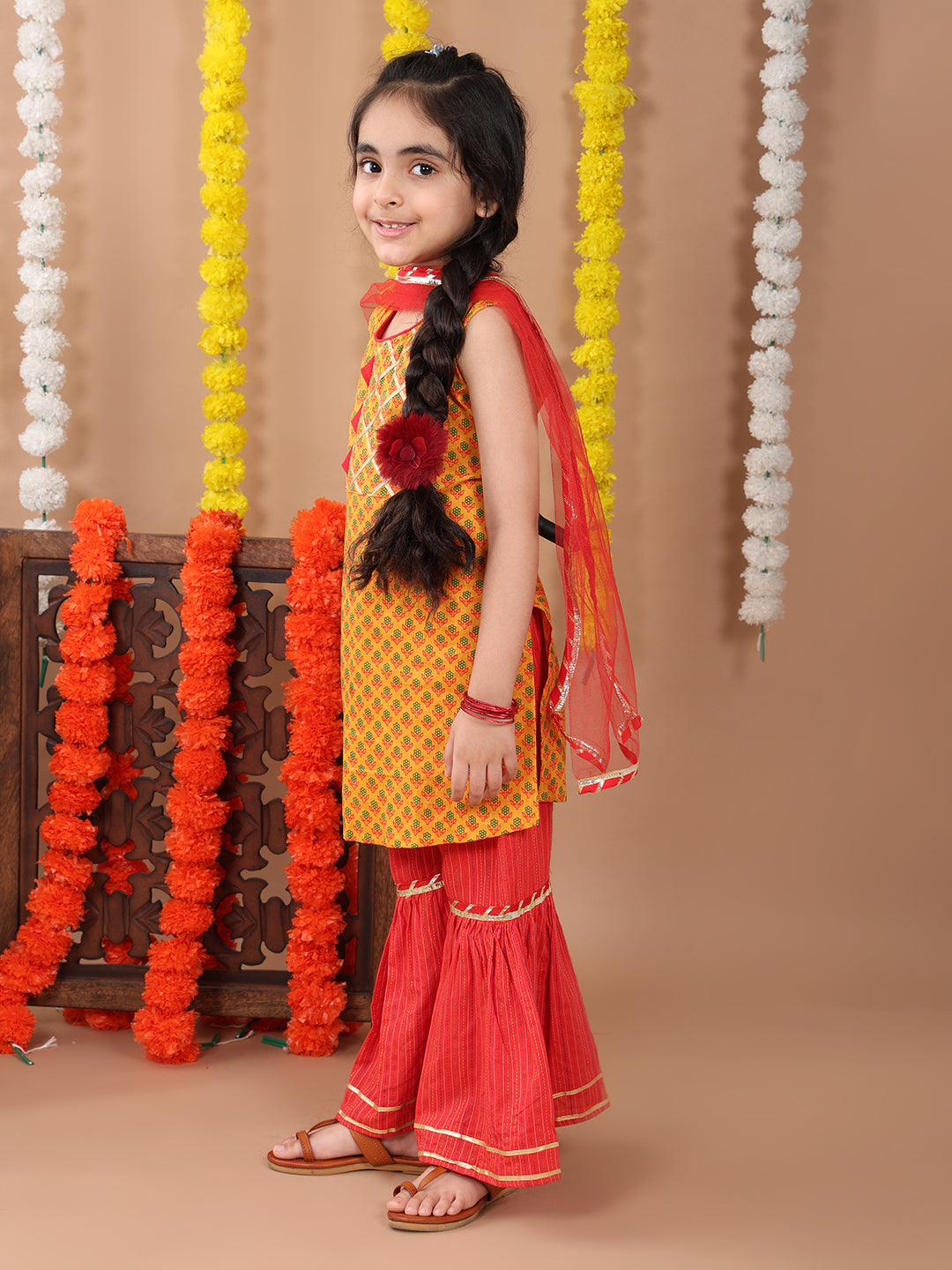 Yellow sleeveless cotton kurti with Red sharara pant and dupatta