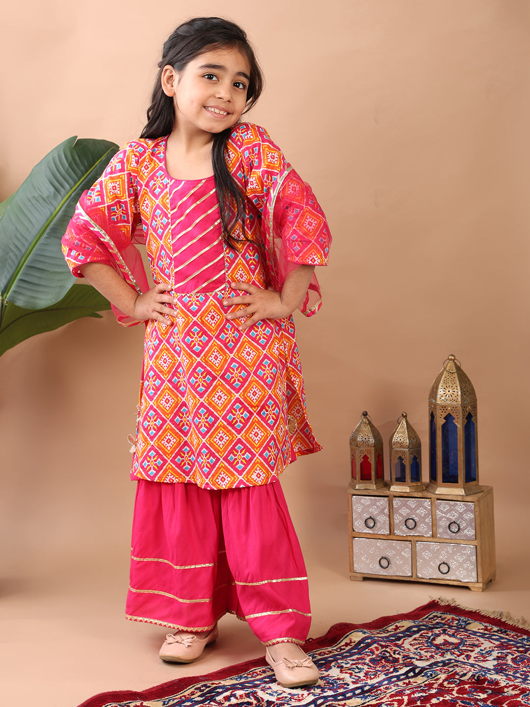 Red Kurti paired with pink sharara pant and dupatta