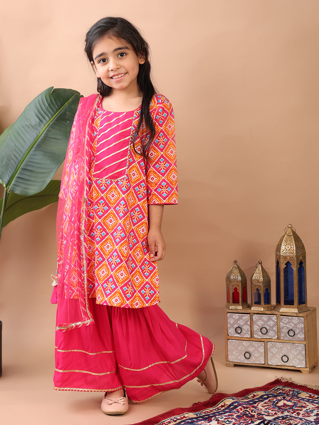 Red Kurti paired with pink sharara pant and dupatta
