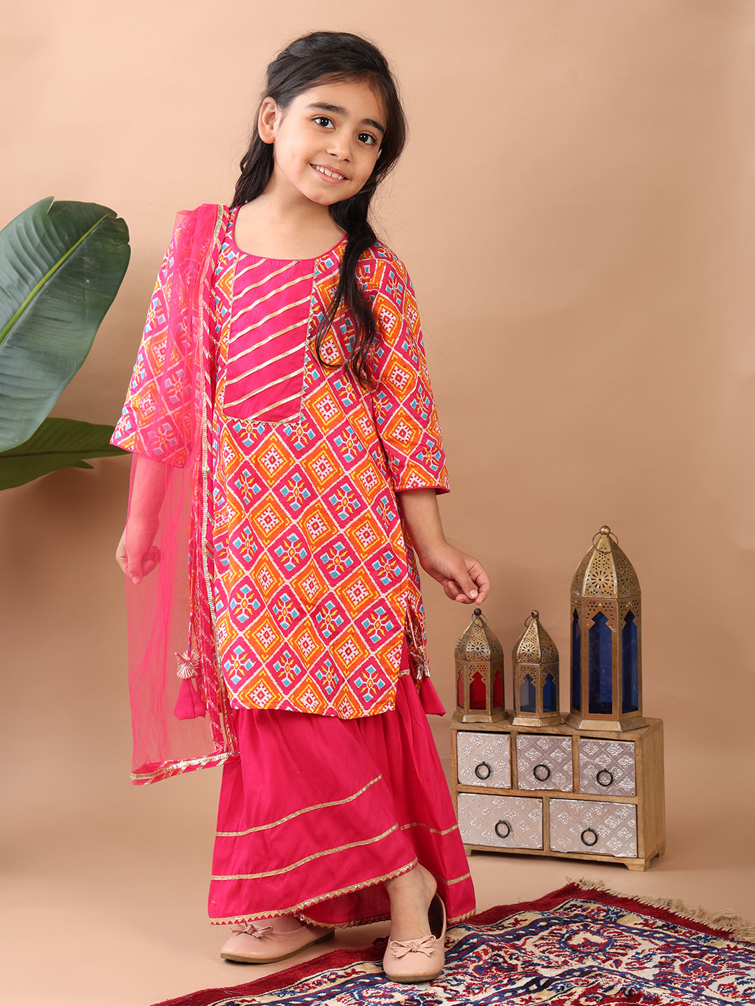 Red Kurti paired with pink sharara pant and dupatta