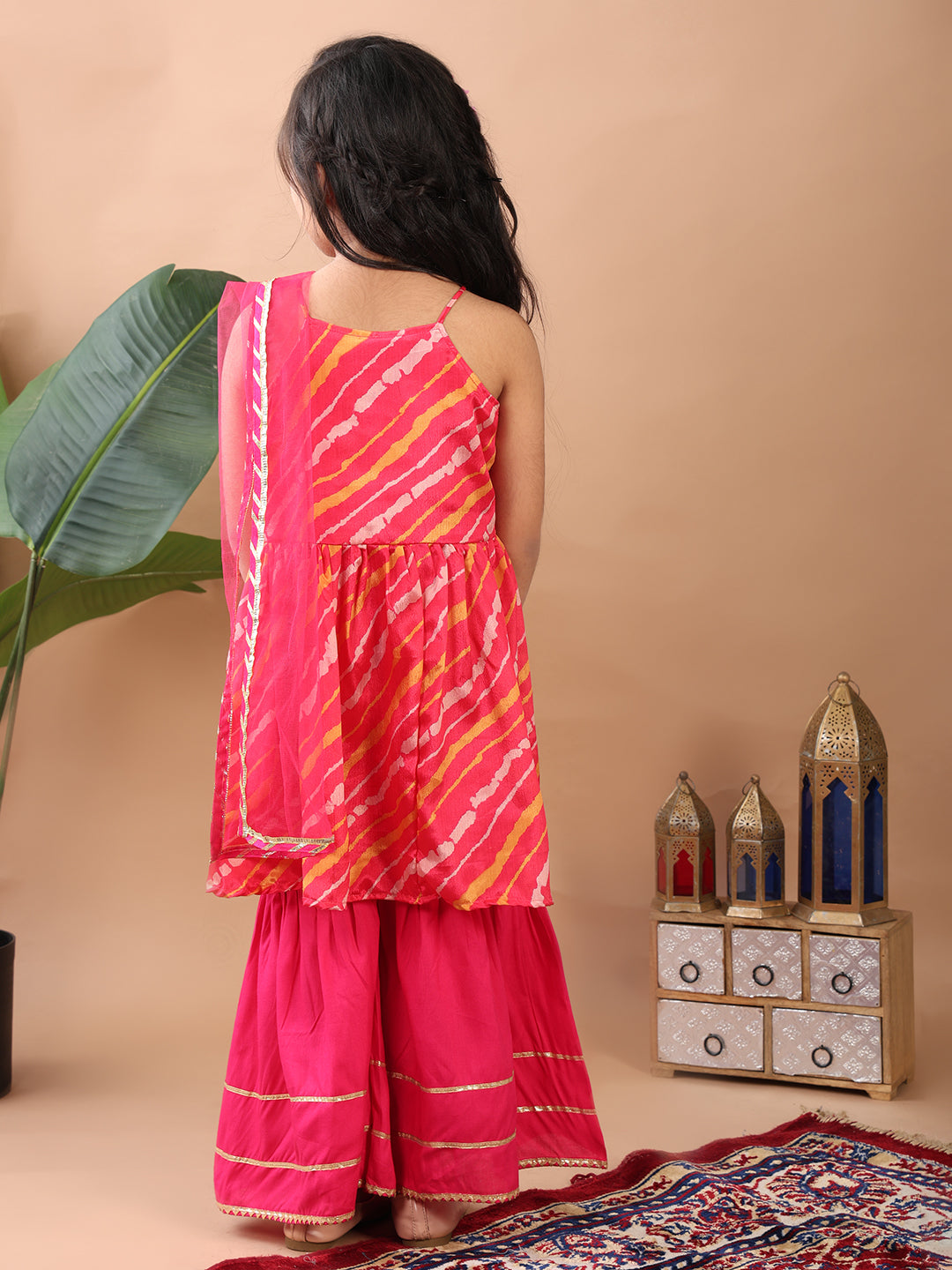 Pink Lehriya printed sleeveless Kurti paired with pink sharara pant and dupatta