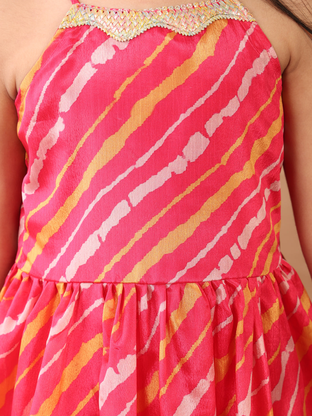 Pink Lehriya printed sleeveless Kurti paired with pink sharara pant and dupatta