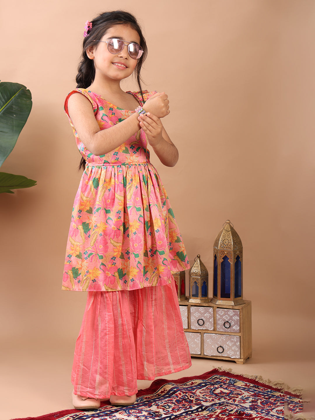 Pink Floral printed sleeveless Kurti paired with pink Lurex sharara pant and dupatta