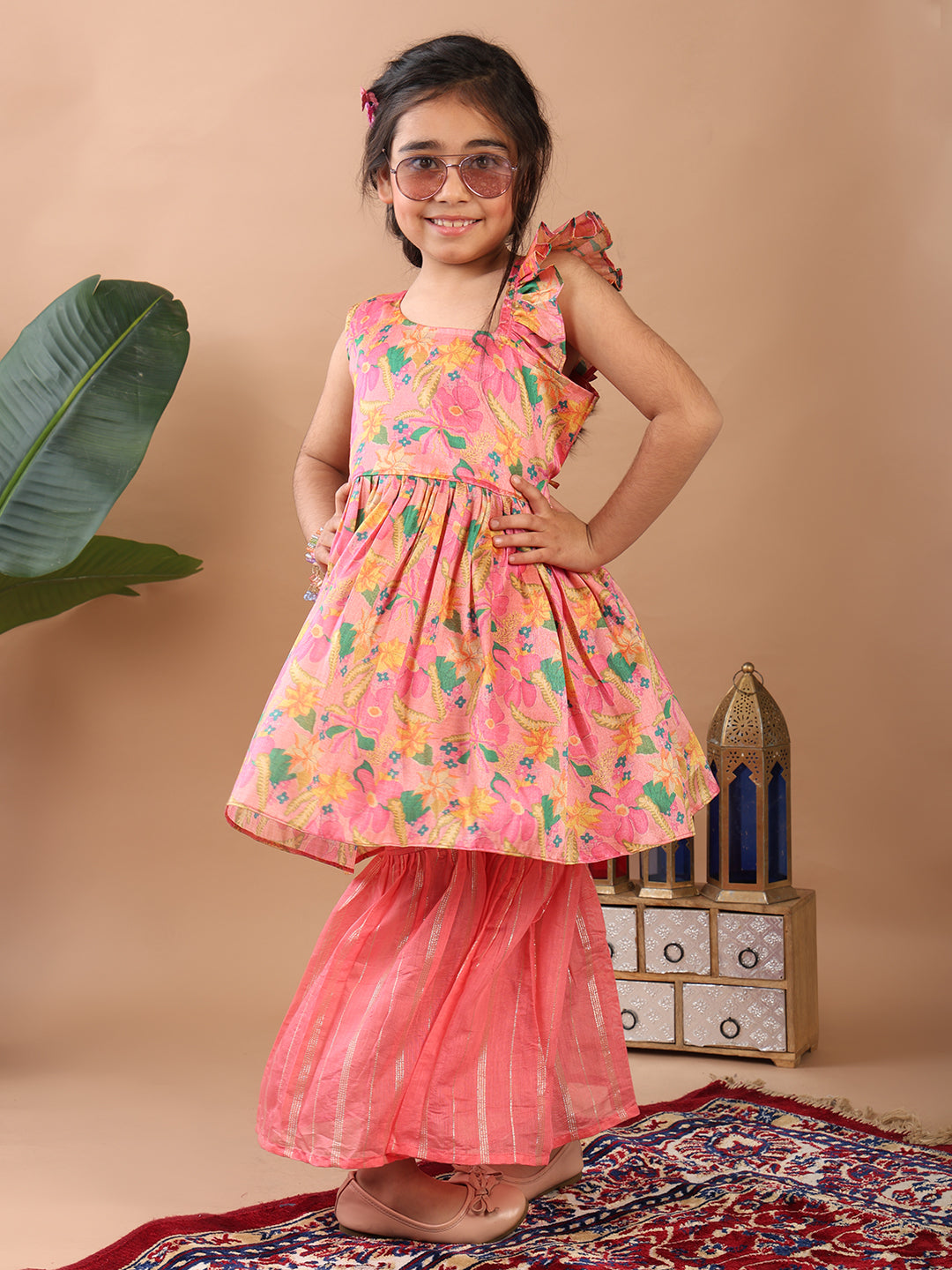 Pink Floral printed sleeveless Kurti paired with pink Lurex sharara pant and dupatta