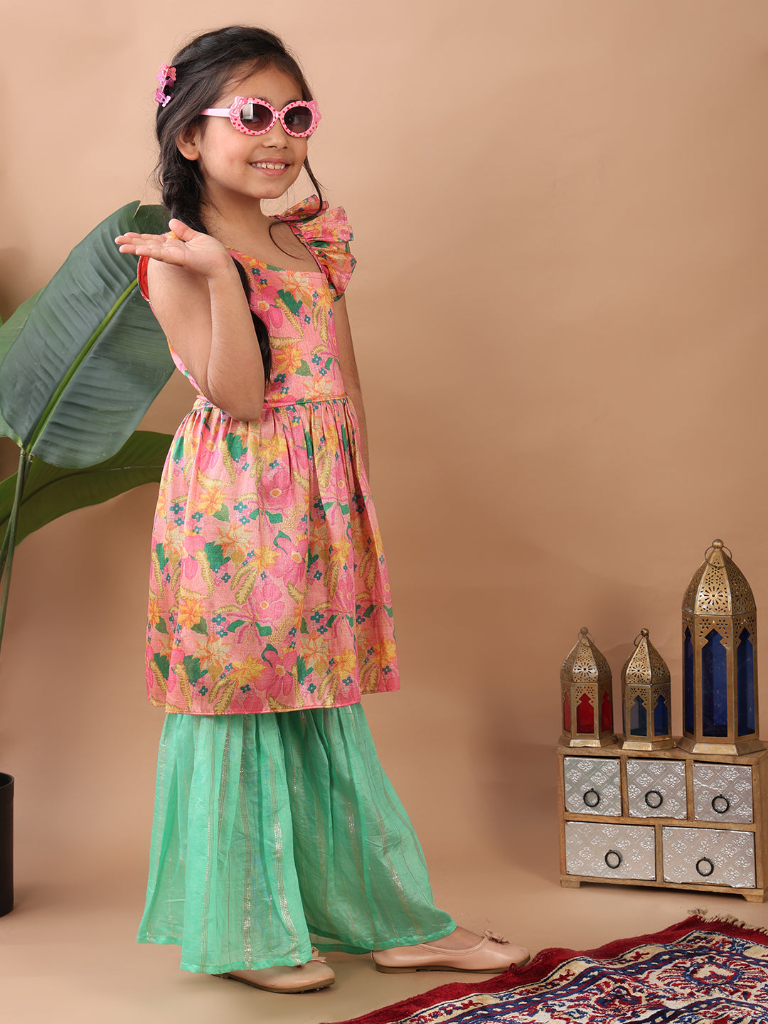 Pink Floral printed sleeveless Kurti paired with Green lurex sharara pant and dupatta