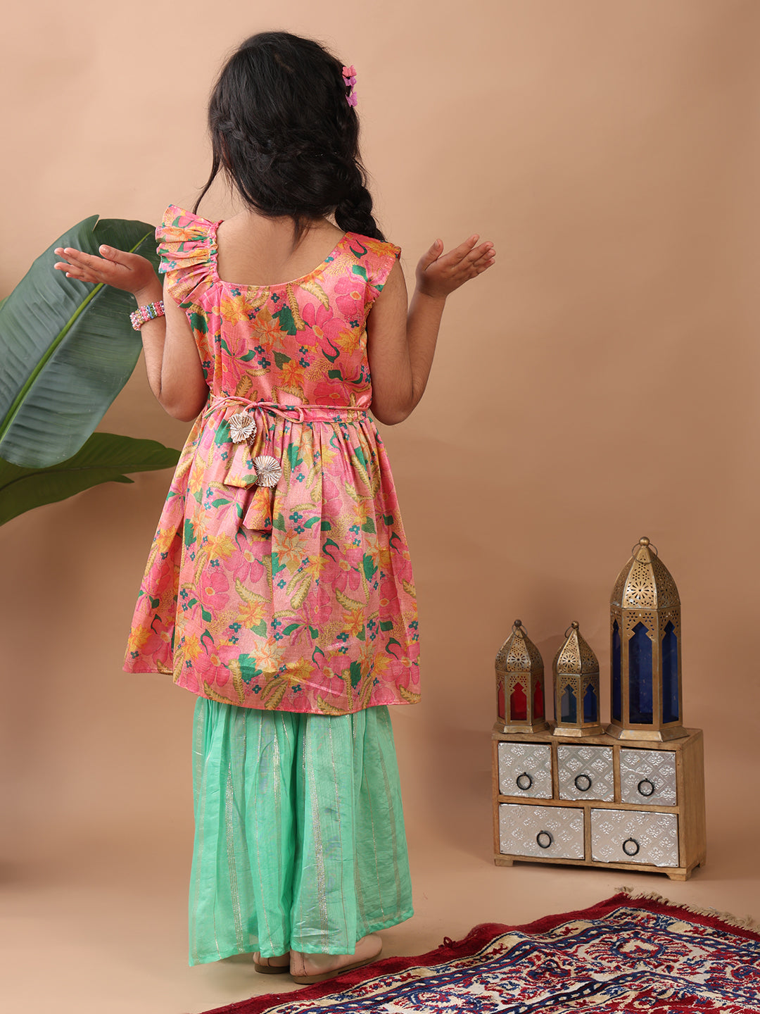 Pink Floral printed sleeveless Kurti paired with Green lurex sharara pant and dupatta