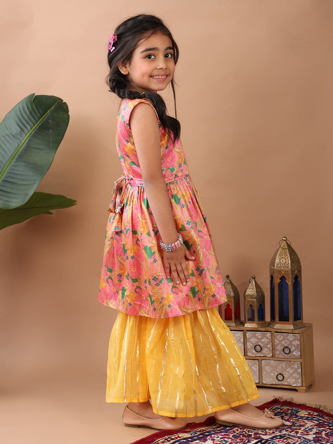 Pink Floral printed sleeveless Kurti paired with Yellow Lurex sharara pant and dupatta