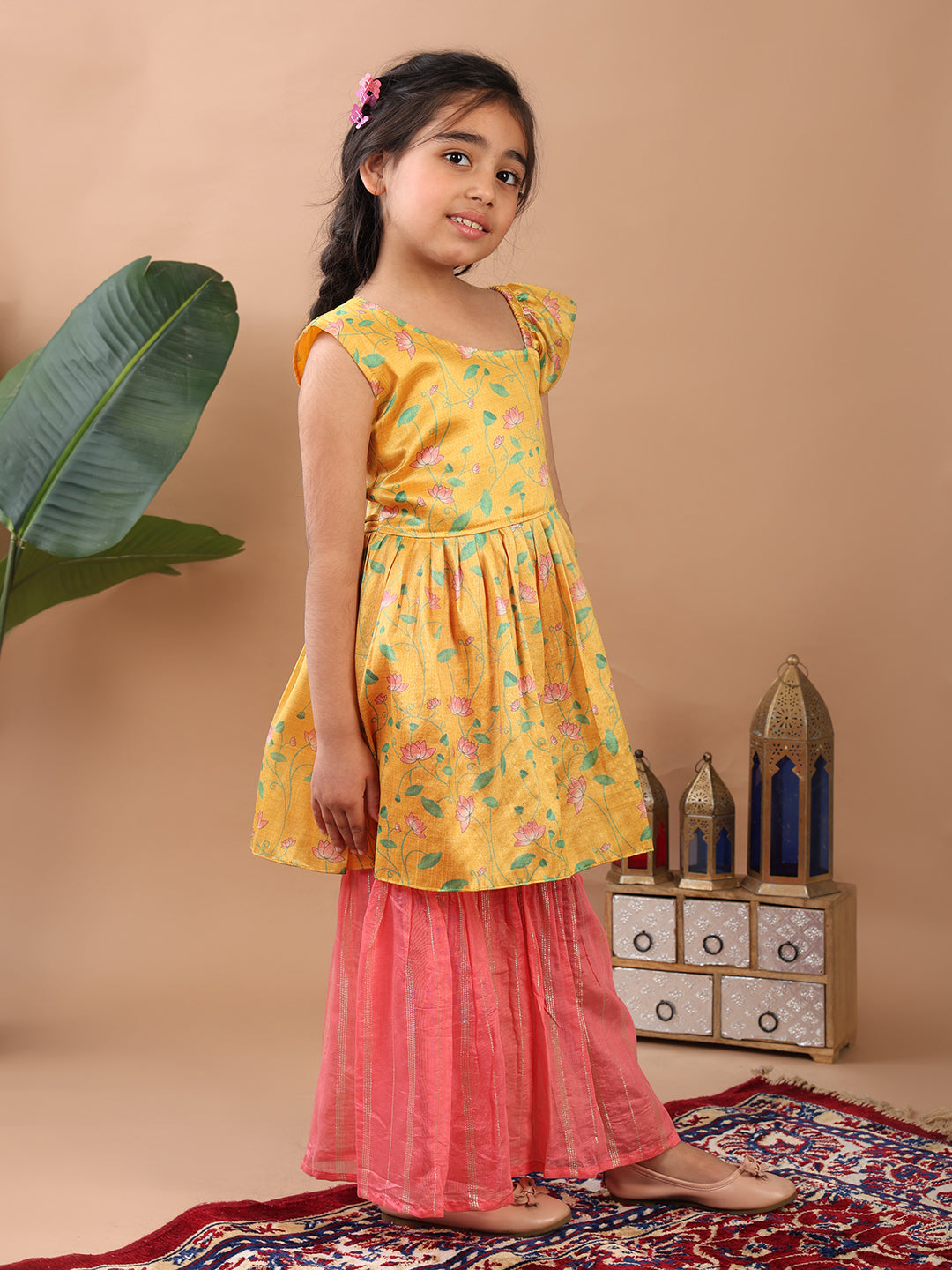 Yellow Lotus printed sleeveless Kurti paired with pink Lurex sharara pant and dupatta