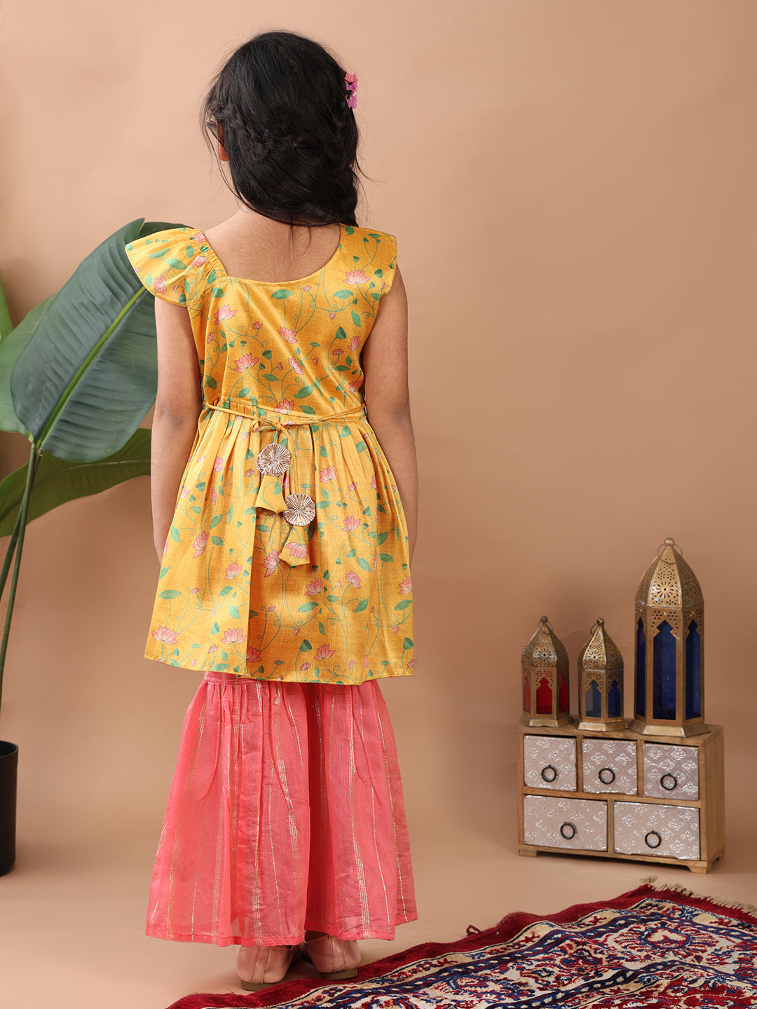 Yellow Lotus printed sleeveless Kurti paired with pink Lurex sharara pant and dupatta