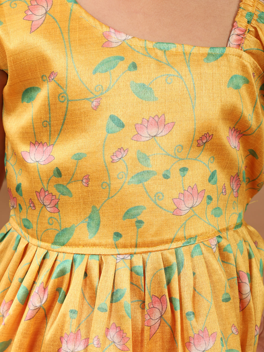 Yellow Lotus printed sleeveless Kurti paired with pink Lurex sharara pant and dupatta