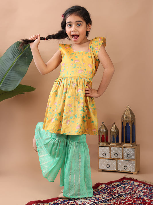 Yellow Lotus printed sleeveless Kurti paired with Green lurex sharara pant and dupatta