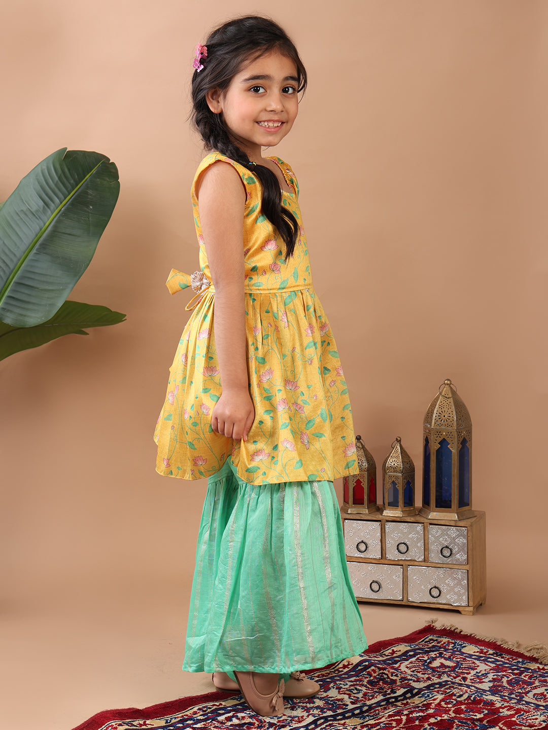 Yellow Lotus printed sleeveless Kurti paired with Green lurex sharara pant and dupatta
