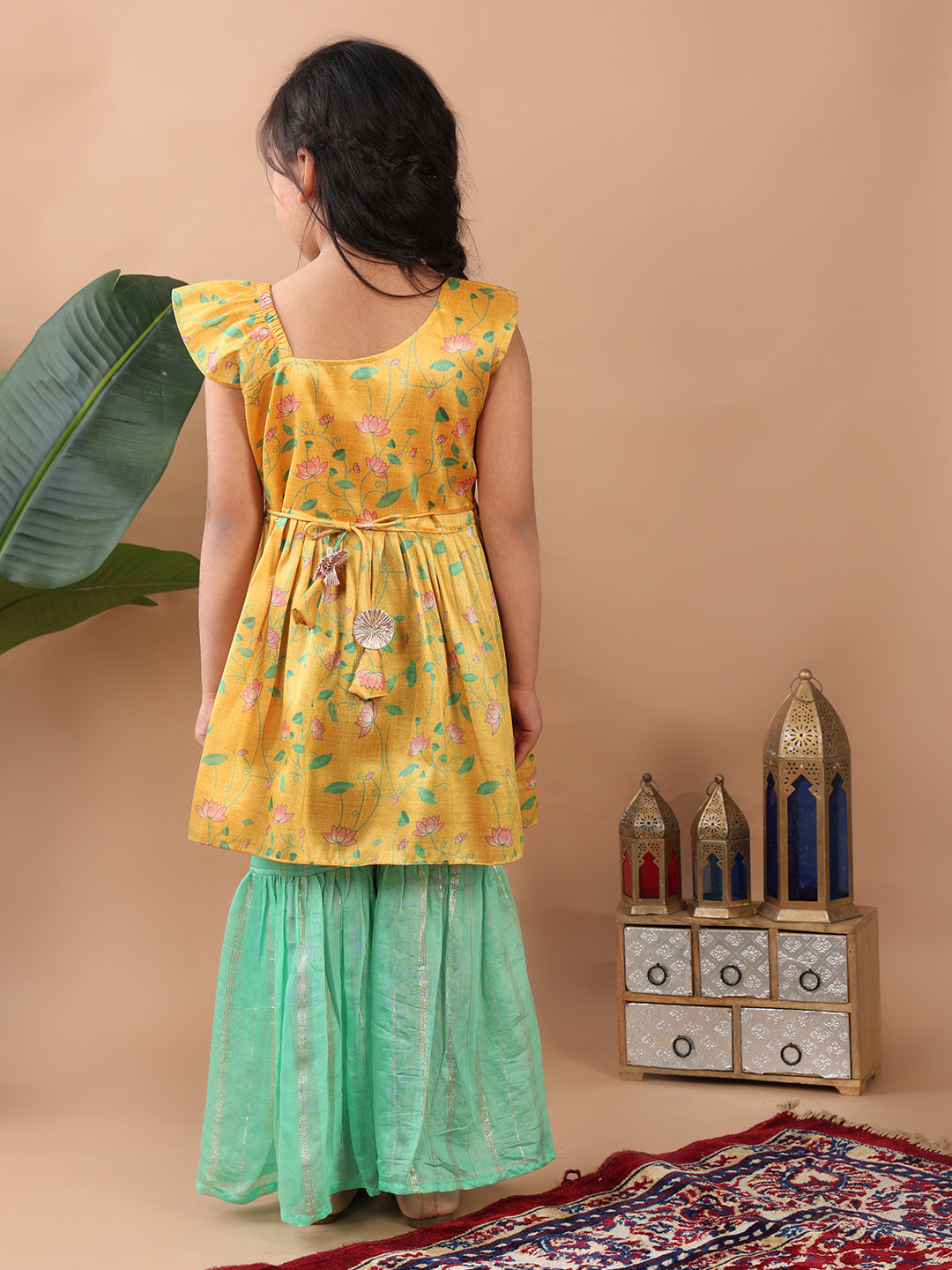 Yellow Lotus printed sleeveless Kurti paired with Green lurex sharara pant and dupatta