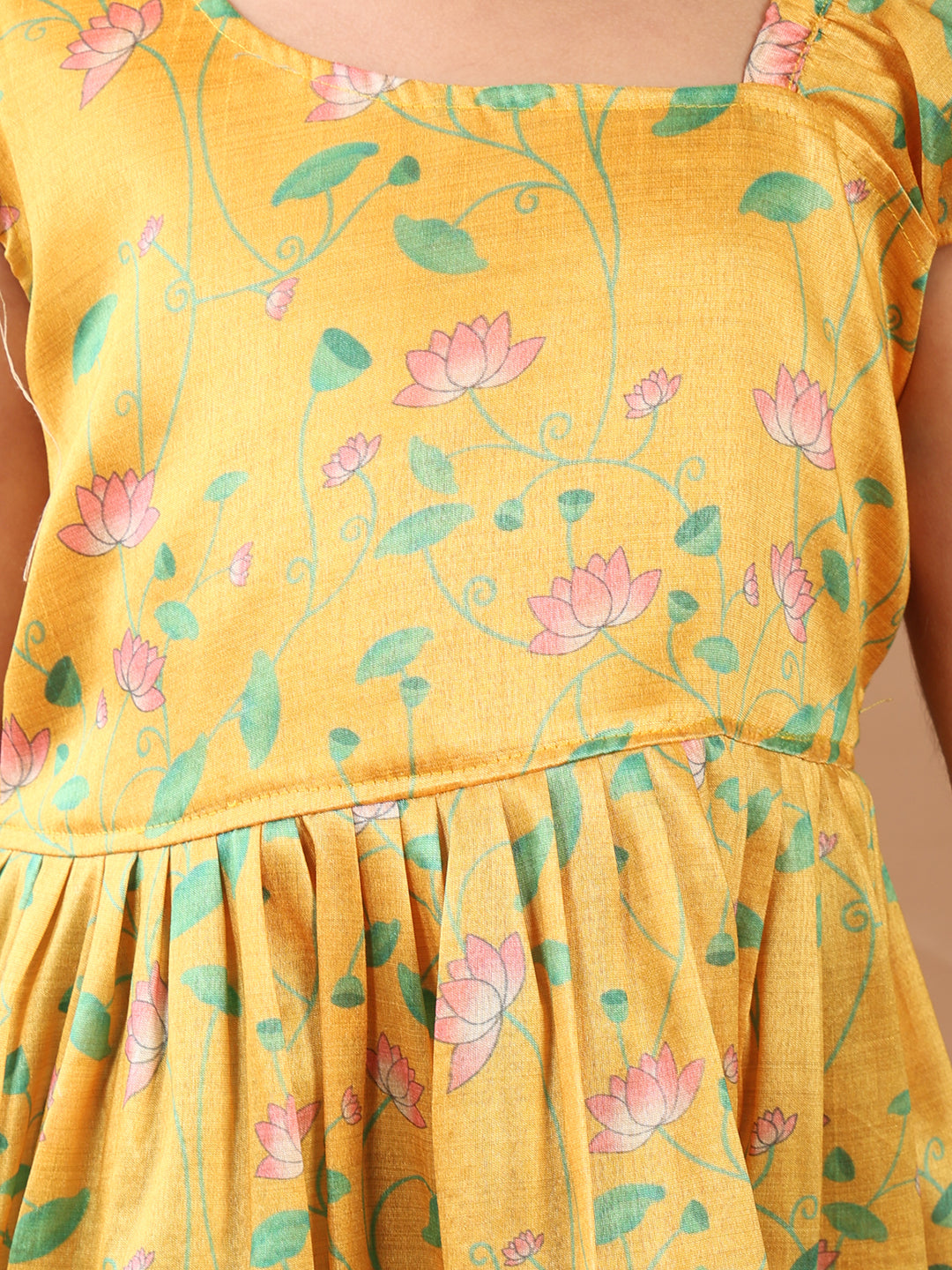 Yellow Lotus printed sleeveless Kurti paired with Green lurex sharara pant and dupatta