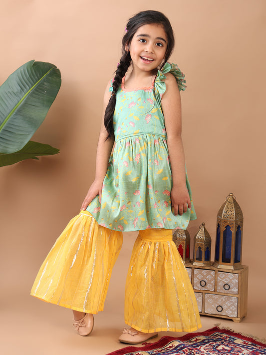 Green Lotus printed sleeveless Kurti paired with yellow Lurex sharara pant and dupatta