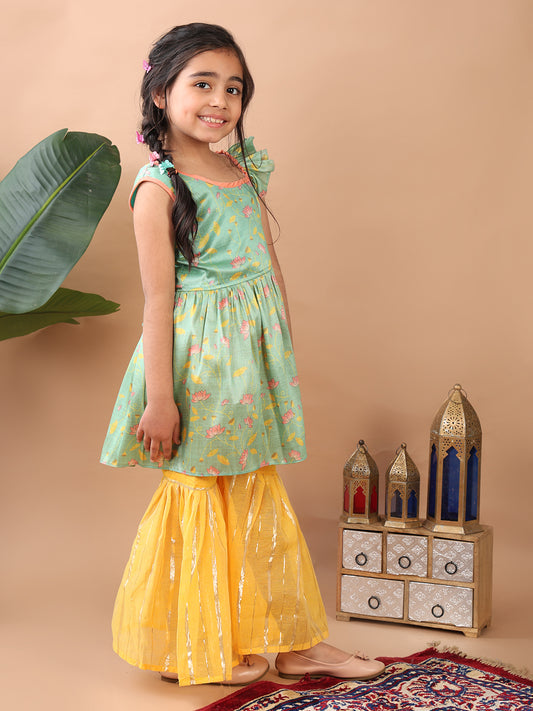 Green Lotus printed sleeveless Kurti paired with yellow Lurex sharara pant and dupatta