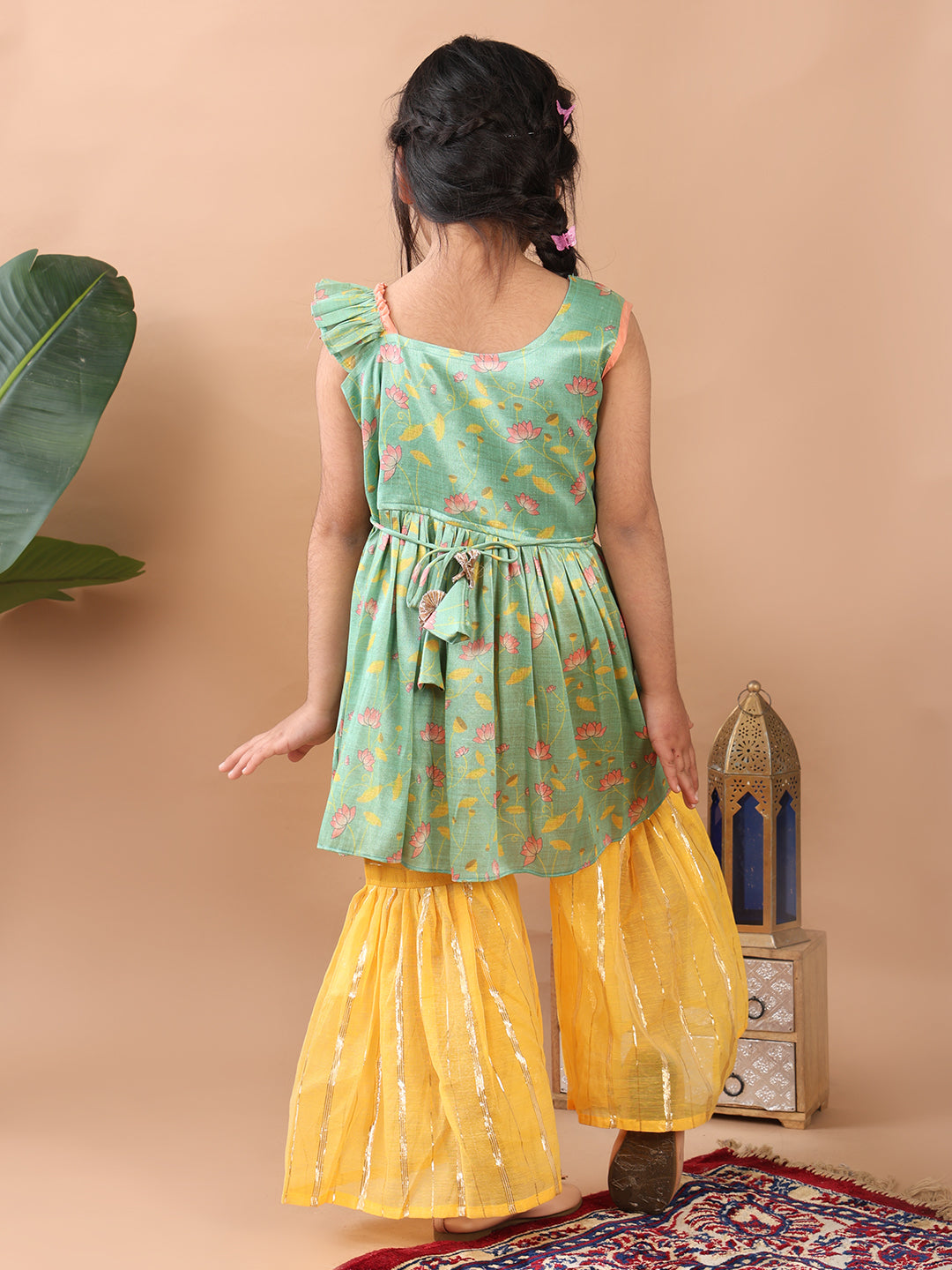 Green Lotus printed sleeveless Kurti paired with yellow Lurex sharara pant and dupatta