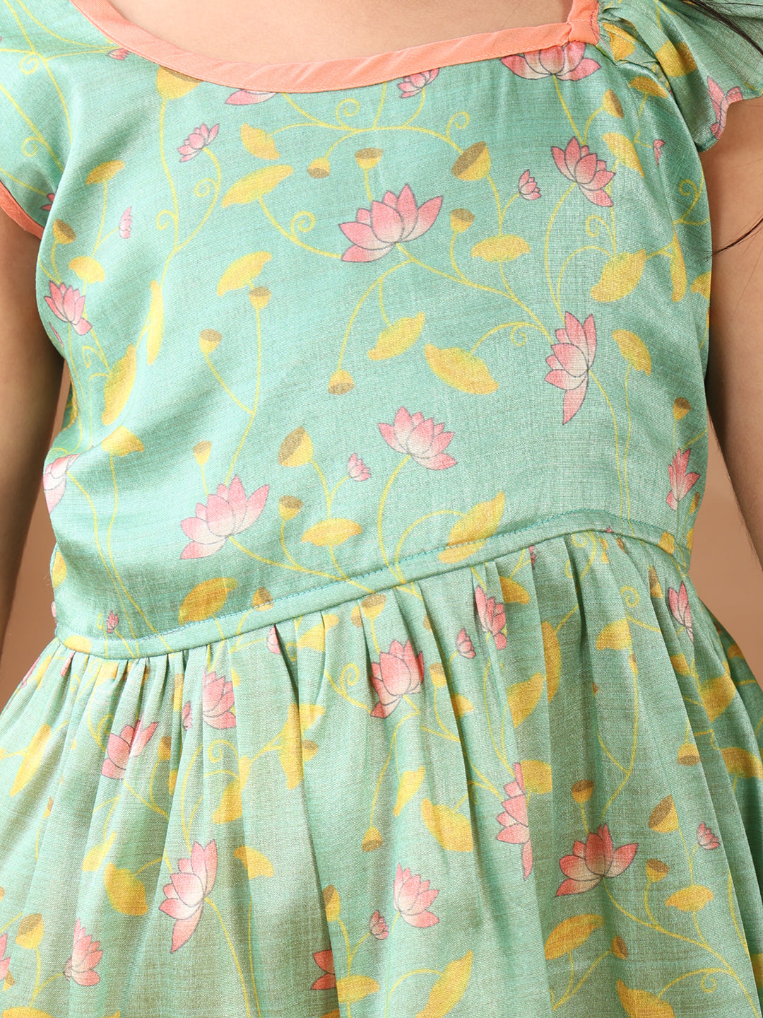 Green Lotus printed sleeveless Kurti paired with yellow Lurex sharara pant and dupatta