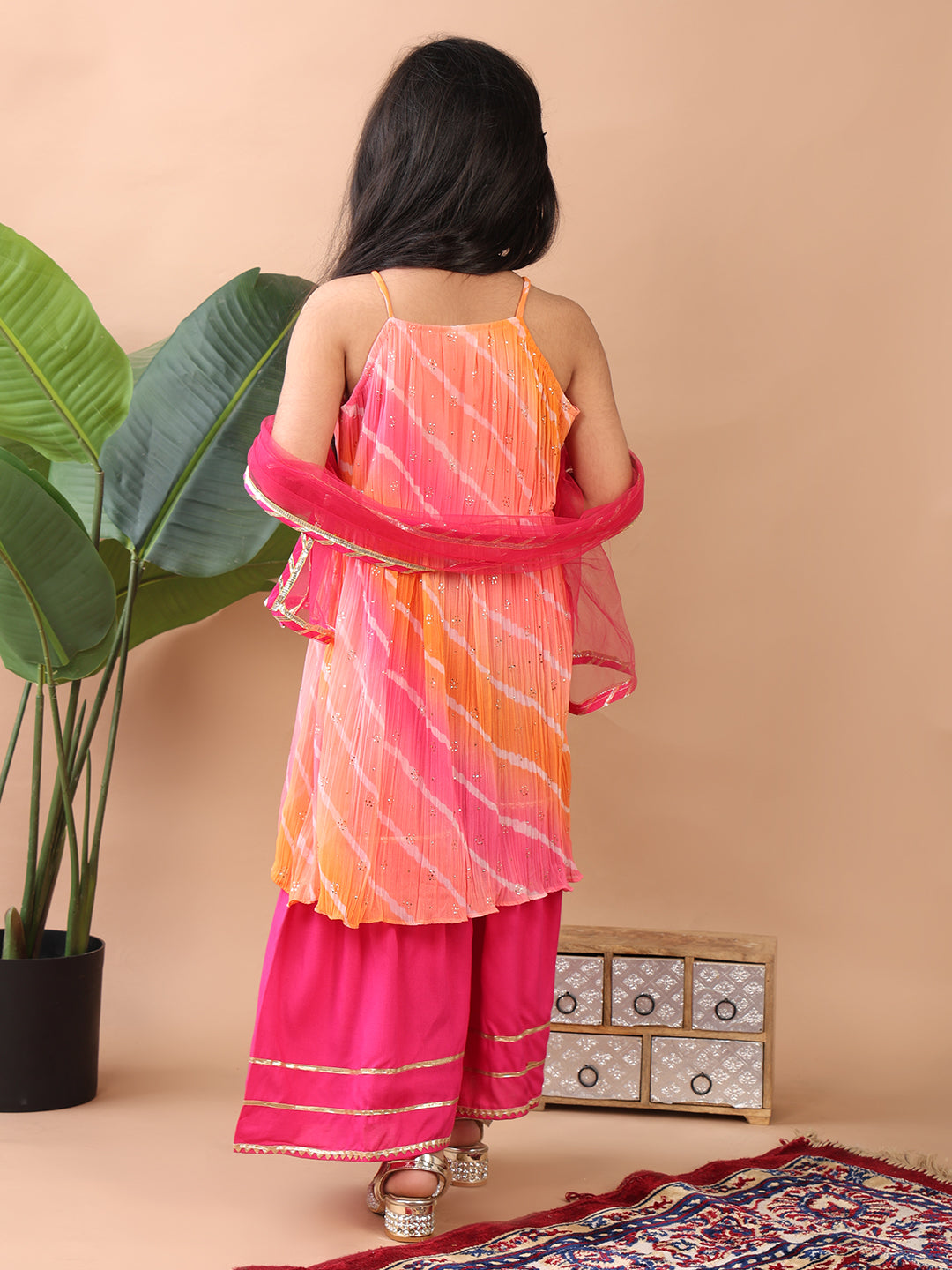 Pink Crushed Lehriya printed sleeveless Kurti paired with pink sharara pant and dupatta