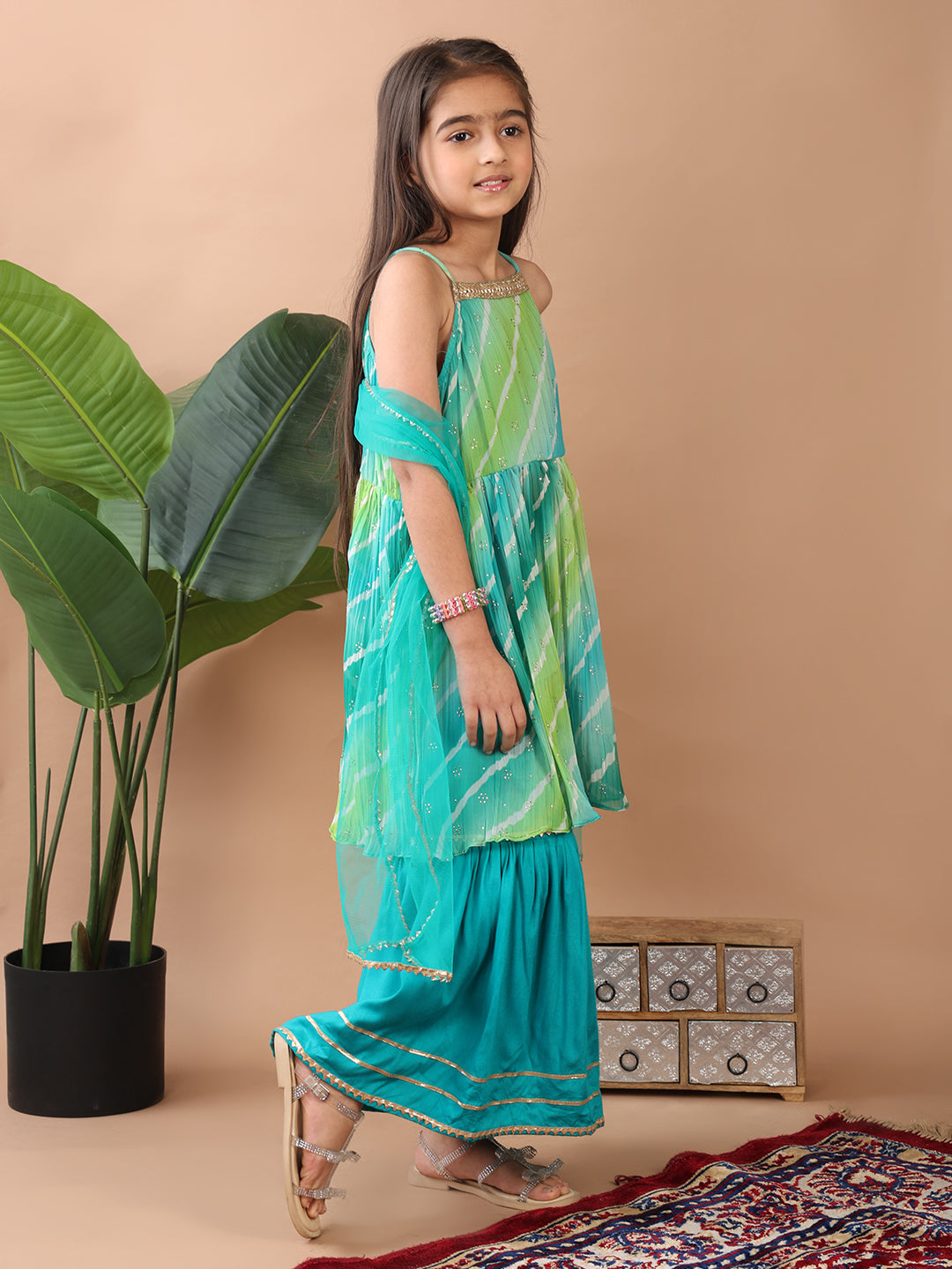 Green Crushed Lehriya printed sleeveless Kurti paired with green sharara pant and dupatta