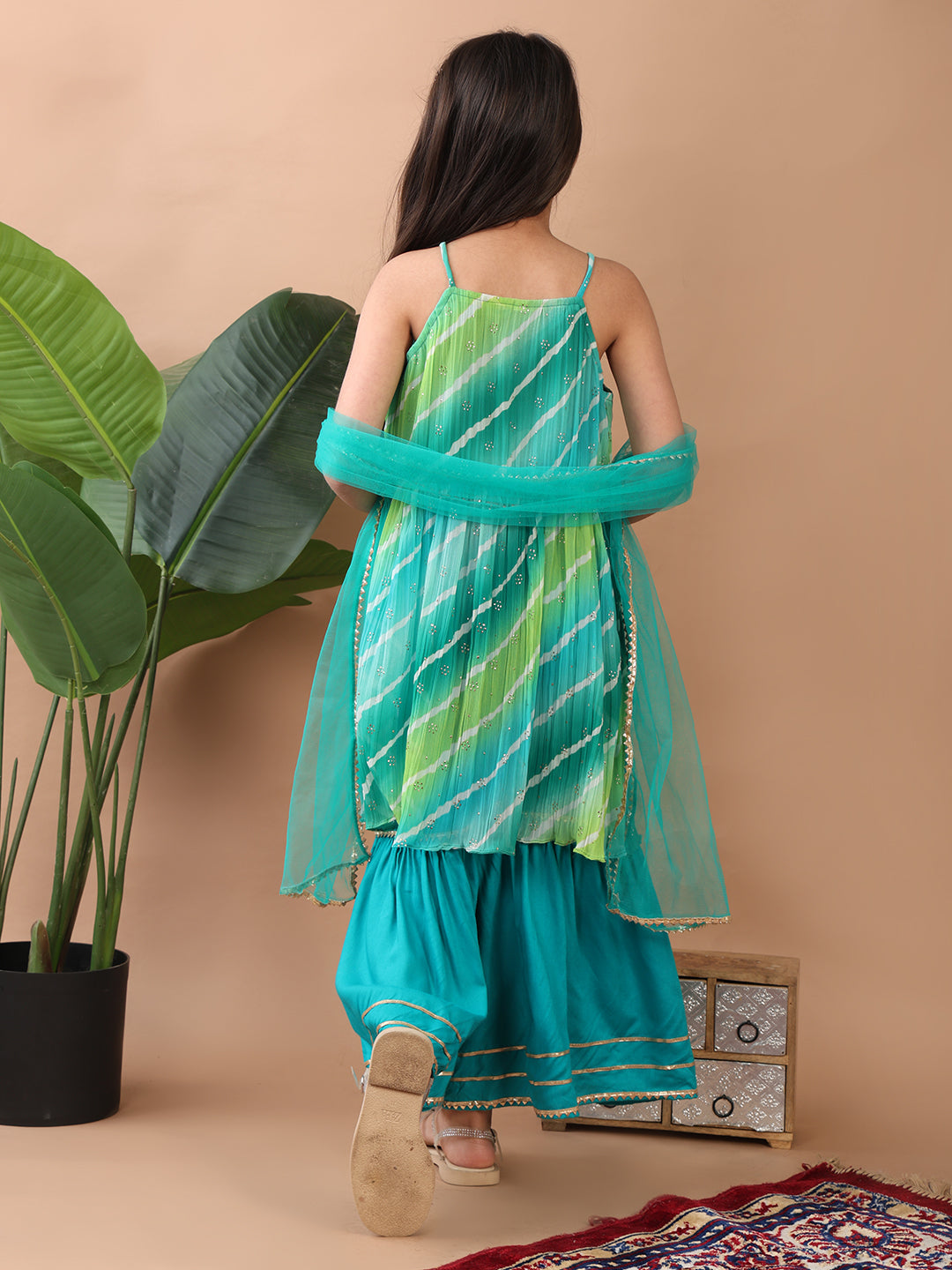 Green Crushed Lehriya printed sleeveless Kurti paired with green sharara pant and dupatta