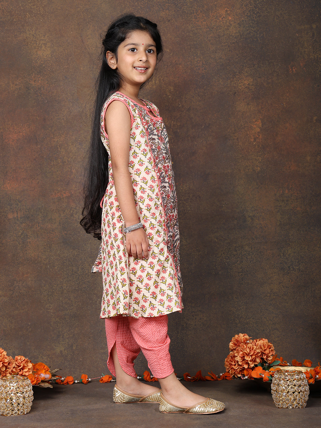 Peach Floral Printed angrakha style sleeveless Kurti paired with peach Dhoti