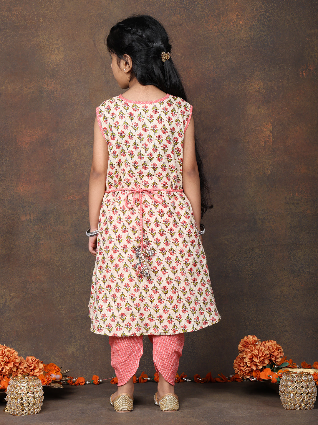 Peach Floral Printed angrakha style sleeveless Kurti paired with peach Dhoti