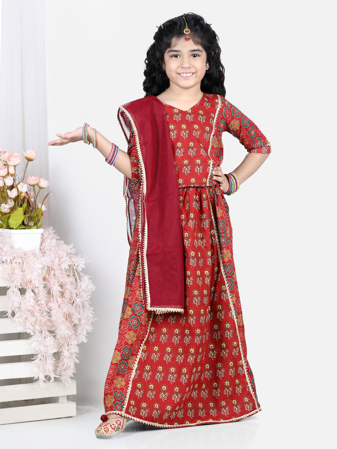 Red motif printed lace embellished top with lehenga and dupatta