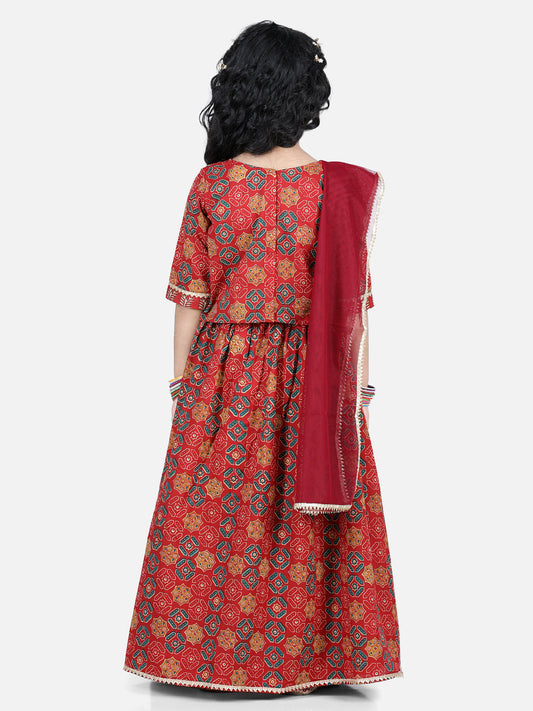 Red motif printed lace embellished top with lehenga and dupatta