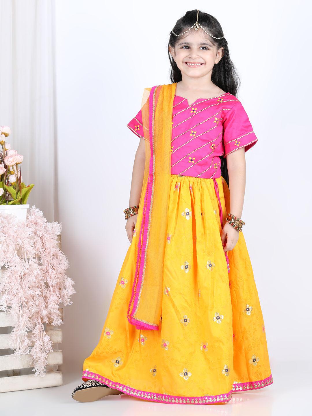 Pink brocade top with yellow lehenga and dupatta