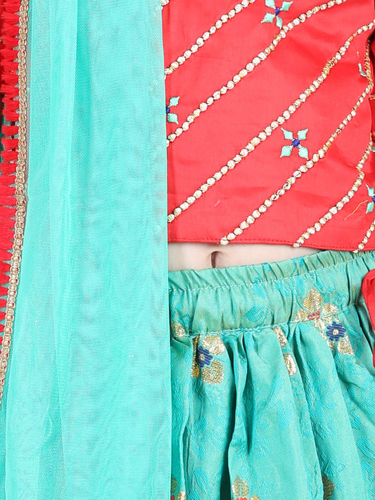 Red brocade top with green lehenga and dupatta