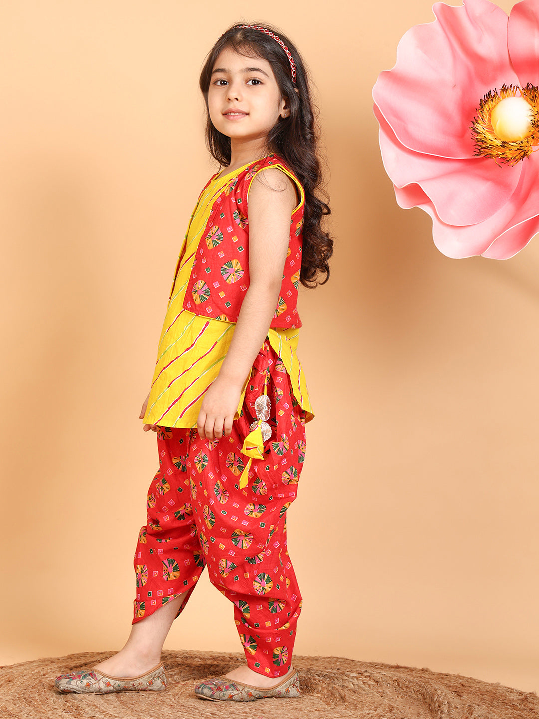 Yellow Lehriya Kurti with red printed dhoti and Jacket