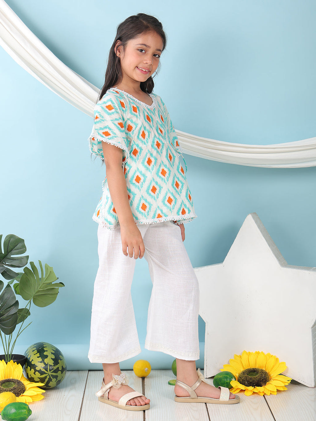 Blue checkered Printed Kaftan paired with white cotton pant