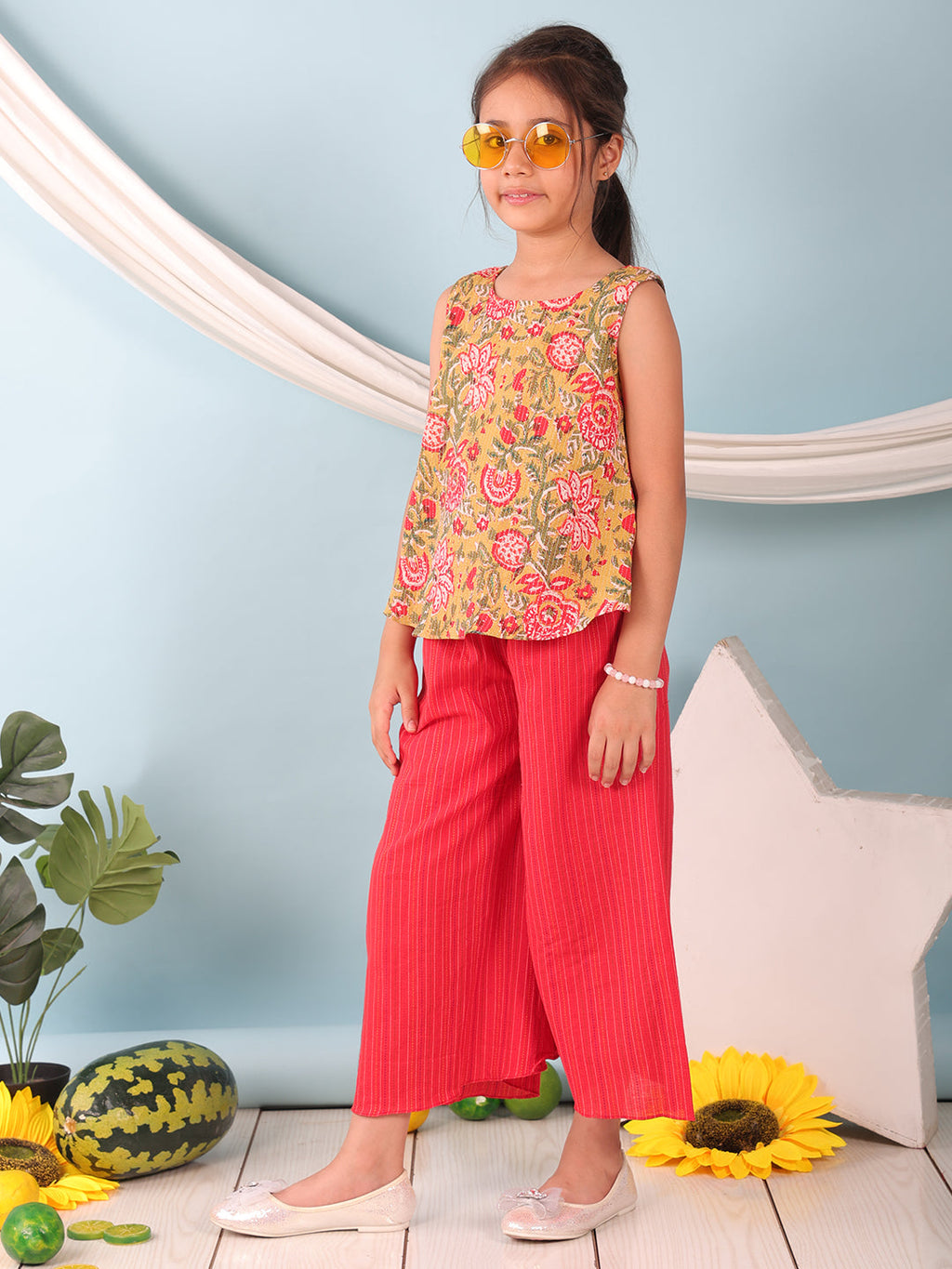 Green floral printed  sleeveless Short Kurti with Red flair pant