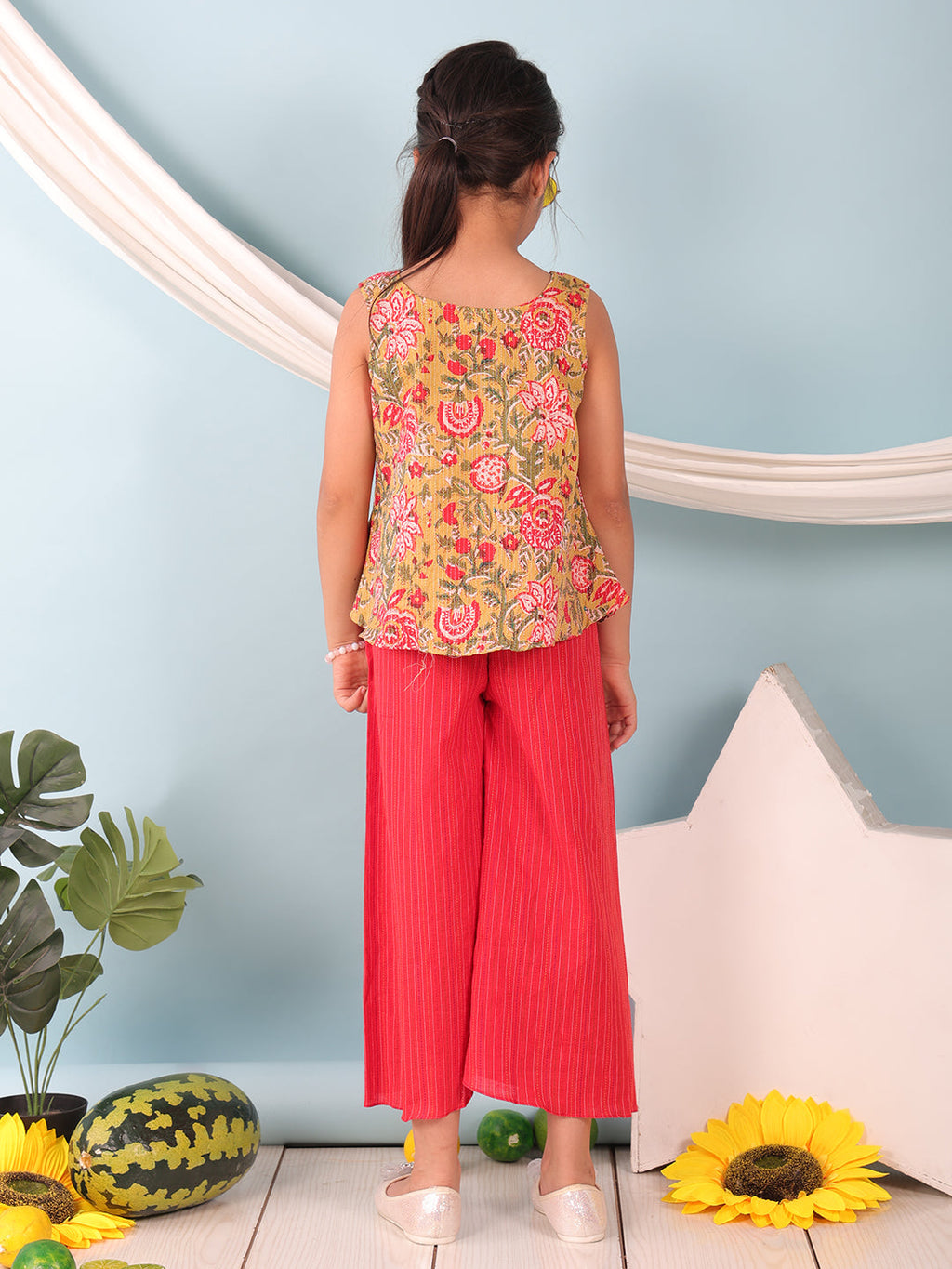 Green floral printed  sleeveless Short Kurti with Red flair pant