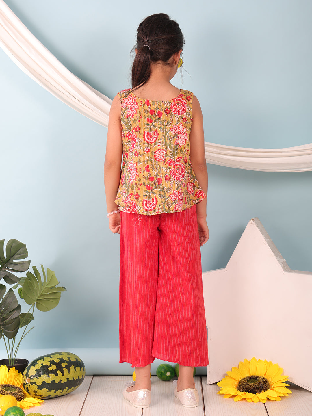 Green floral printed  sleeveless Short Kurti with Red flair pant