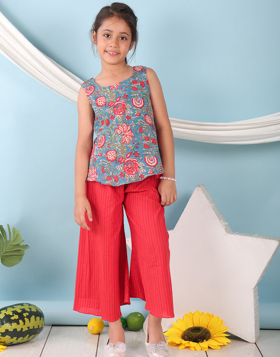 Blue floral printed  sleeveless Short Kurti with Red flair pant