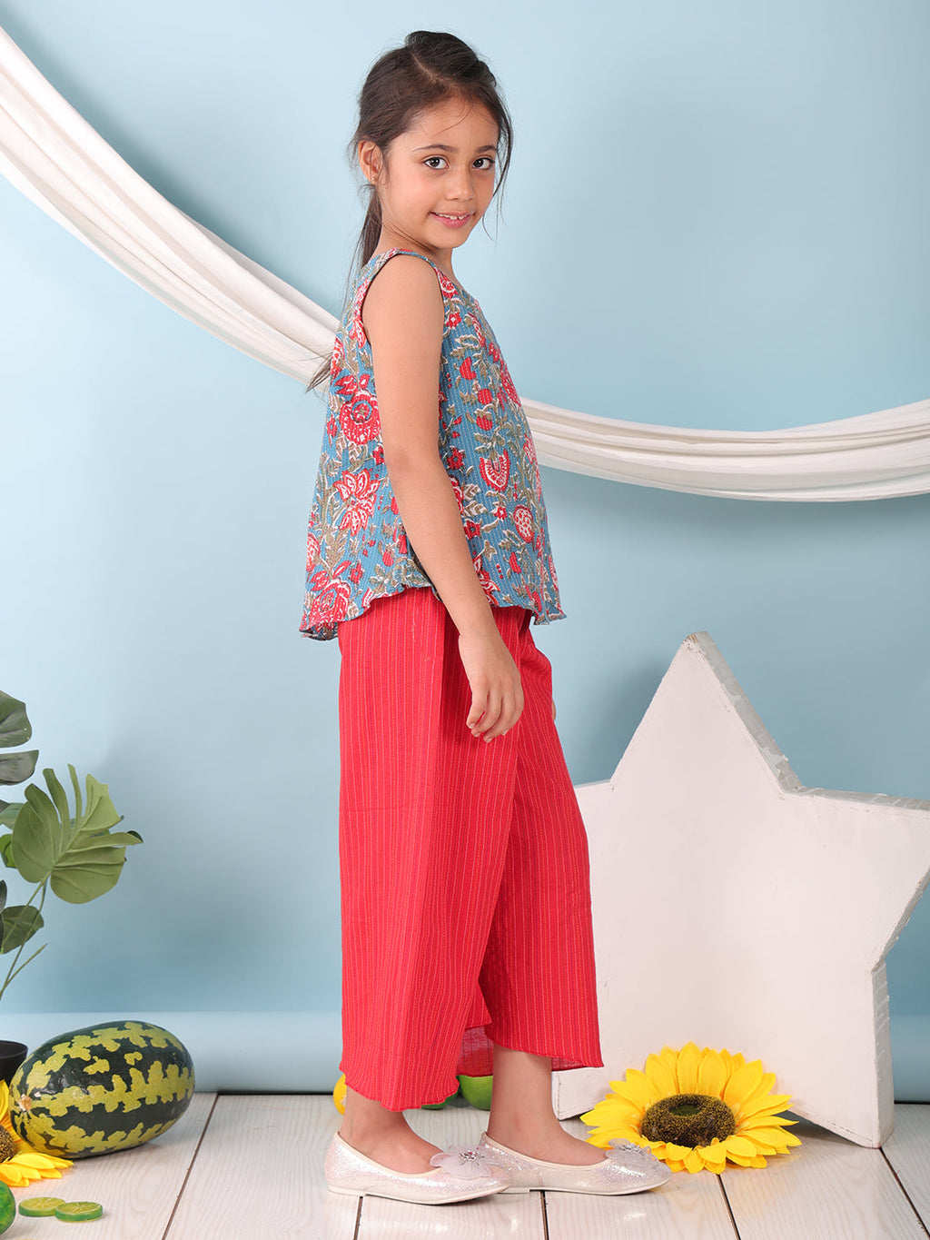 Blue floral printed  sleeveless Short Kurti with Red flair pant