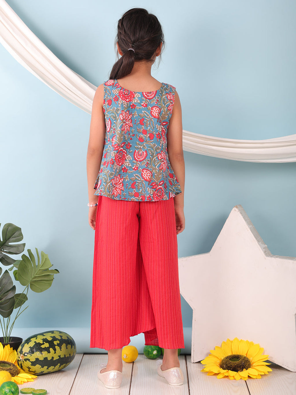 Blue floral printed  sleeveless Short Kurti with Red flair pant