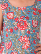 Blue floral printed  sleeveless Short Kurti with Red flair pant