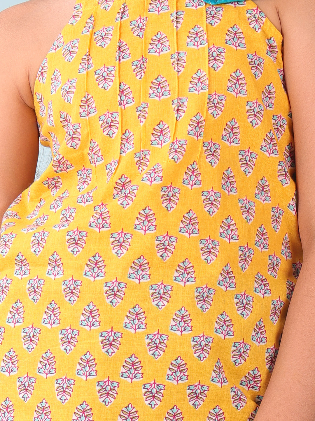 Yellow floral sleeveless tie on Kurti with Blue Dhoti